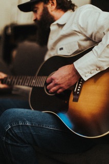 Matt Steinfeld playing acoustic guitar