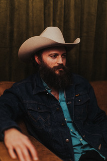 Matt Steinfeld in a cowboy hat and denim jacket